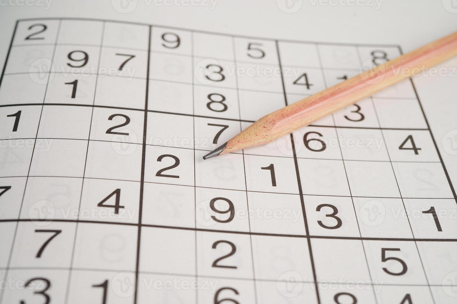 Sudoku puzzle, game to play for keep you brain younger for developing Alzheimer disease in senior patient. photo