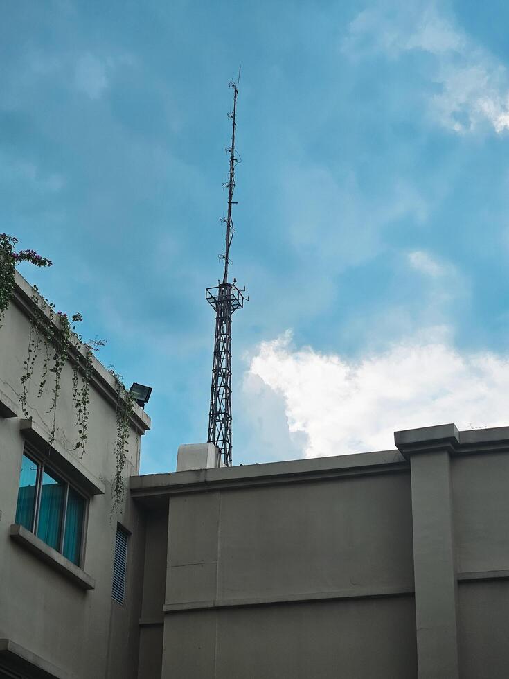 Transmitter tower seen from behind the building photo