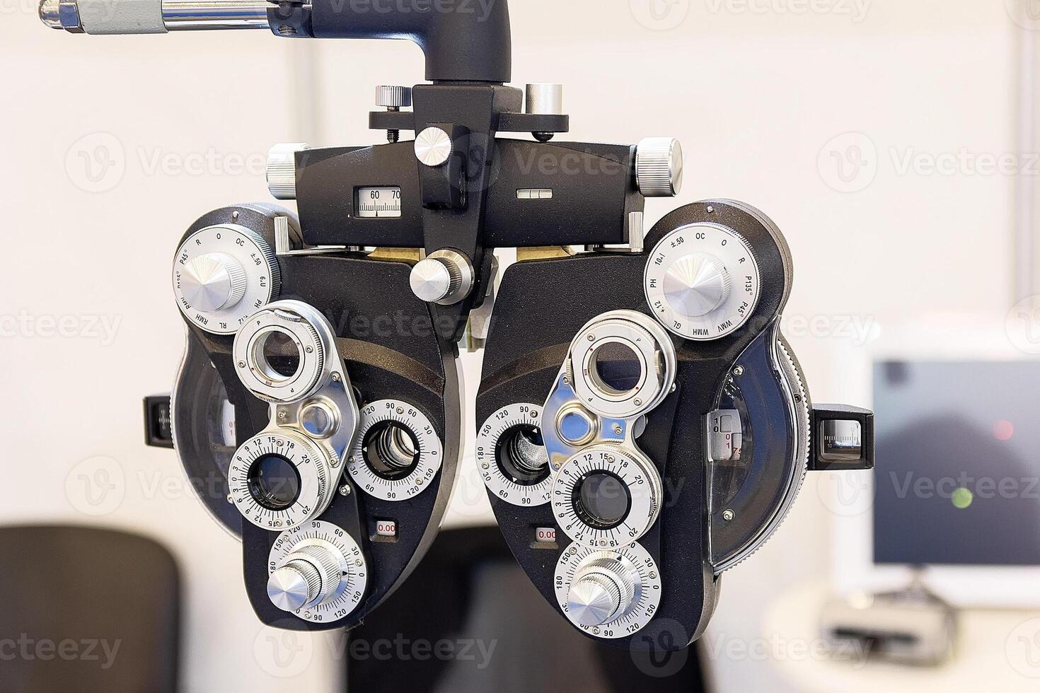 Phoropter used for eye examination to measure refractive error to determine eyeglass prescriptions photo