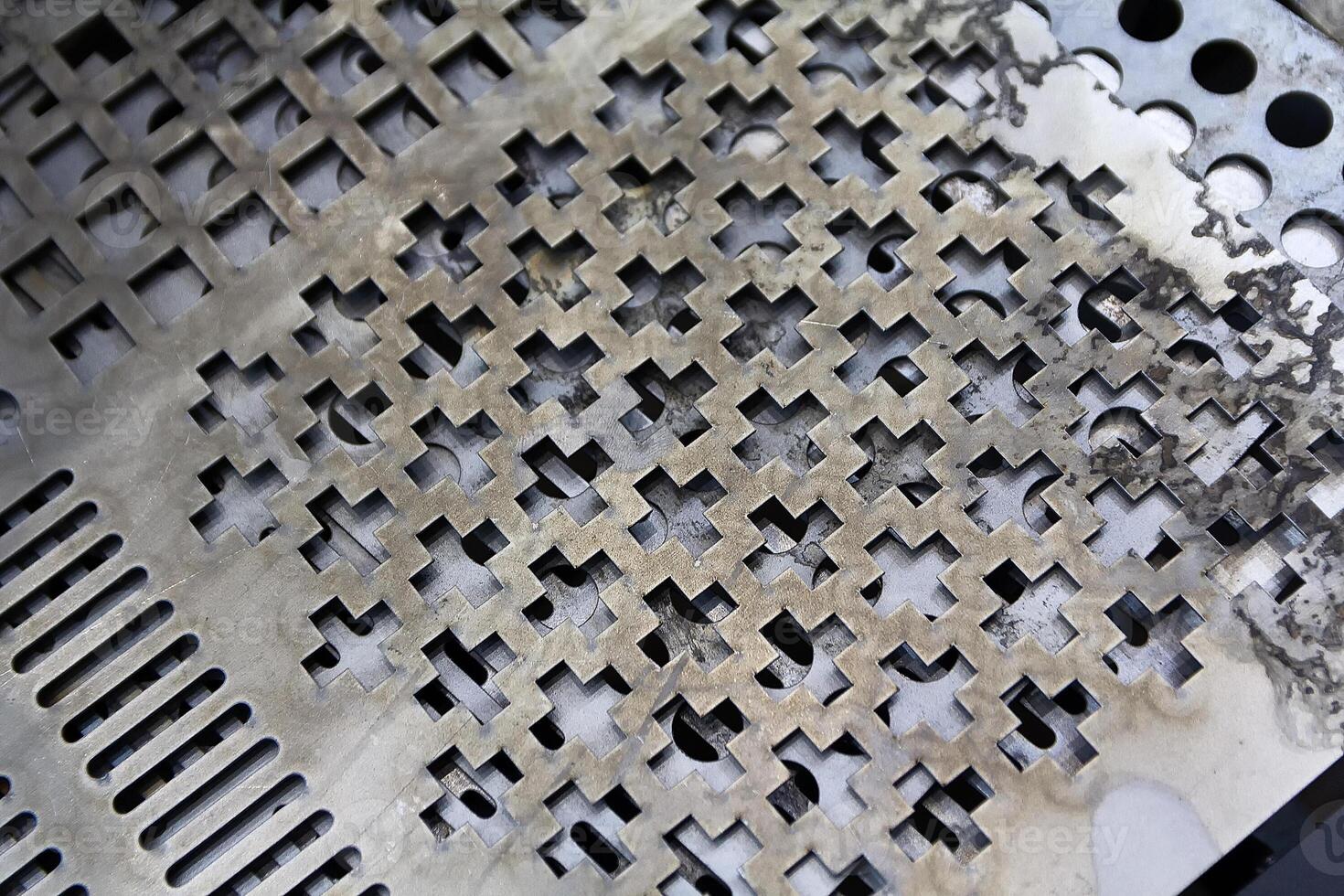 Metal sheet with holesm ade by laser cutting photo
