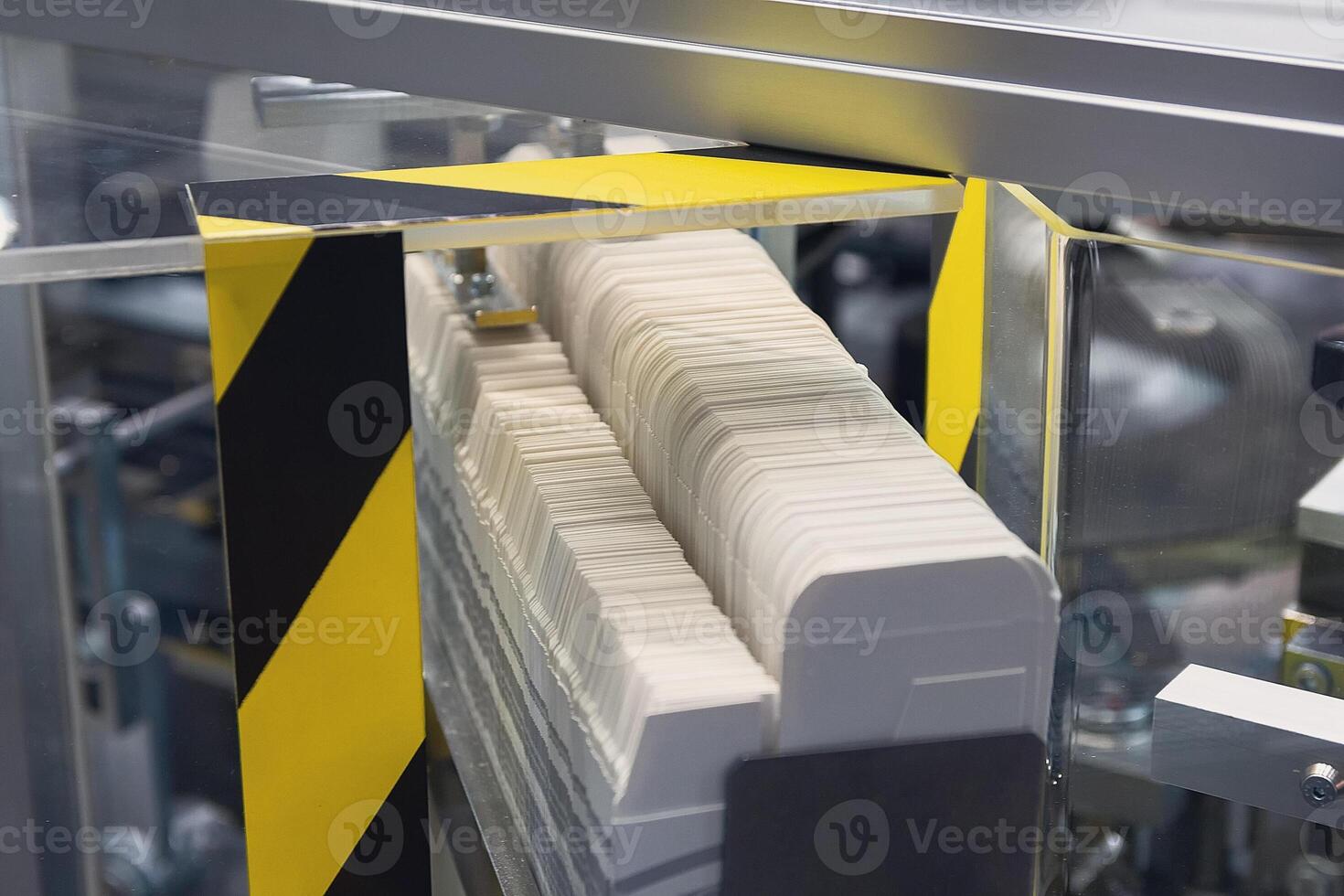 Machine conveyor of the production line of paper packaging boxes in a factory photo