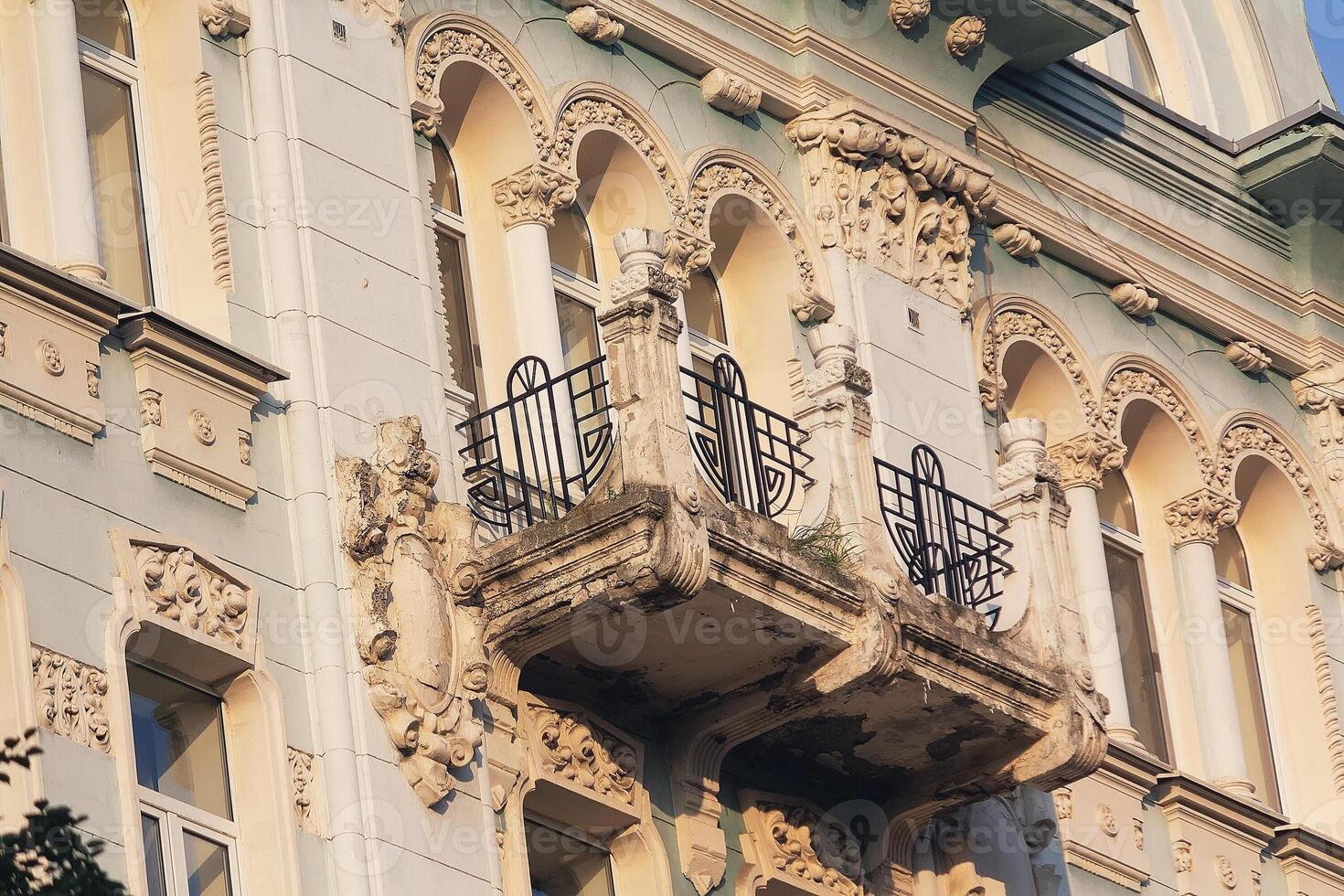 Beautiful facade with a balcony of a classical style building photo