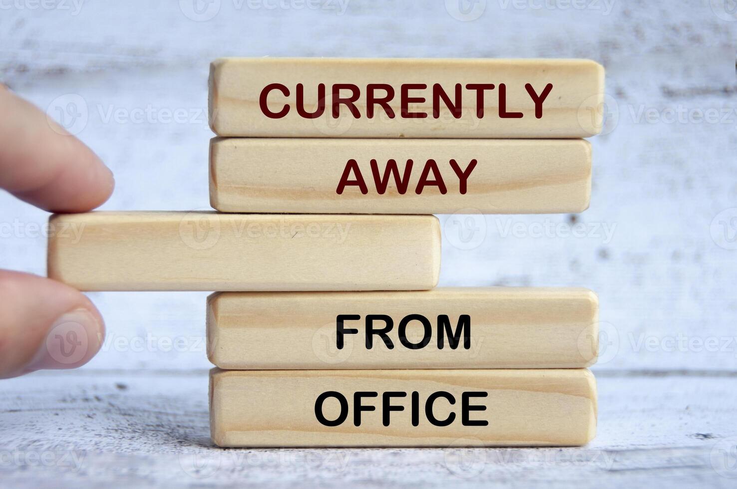 Currently away from office text on wooden blocks. Out of office concept photo