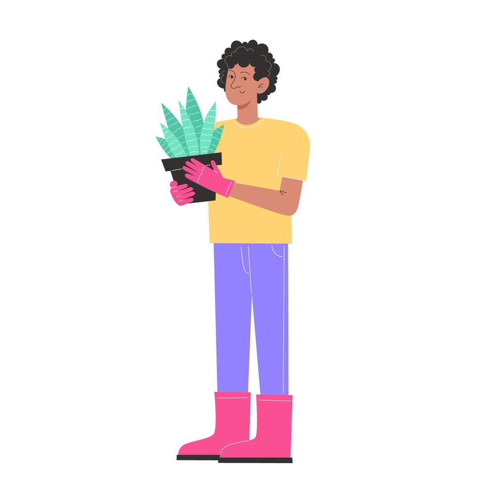 A young man is standing in garden clothes and holding a flower in a pot vector