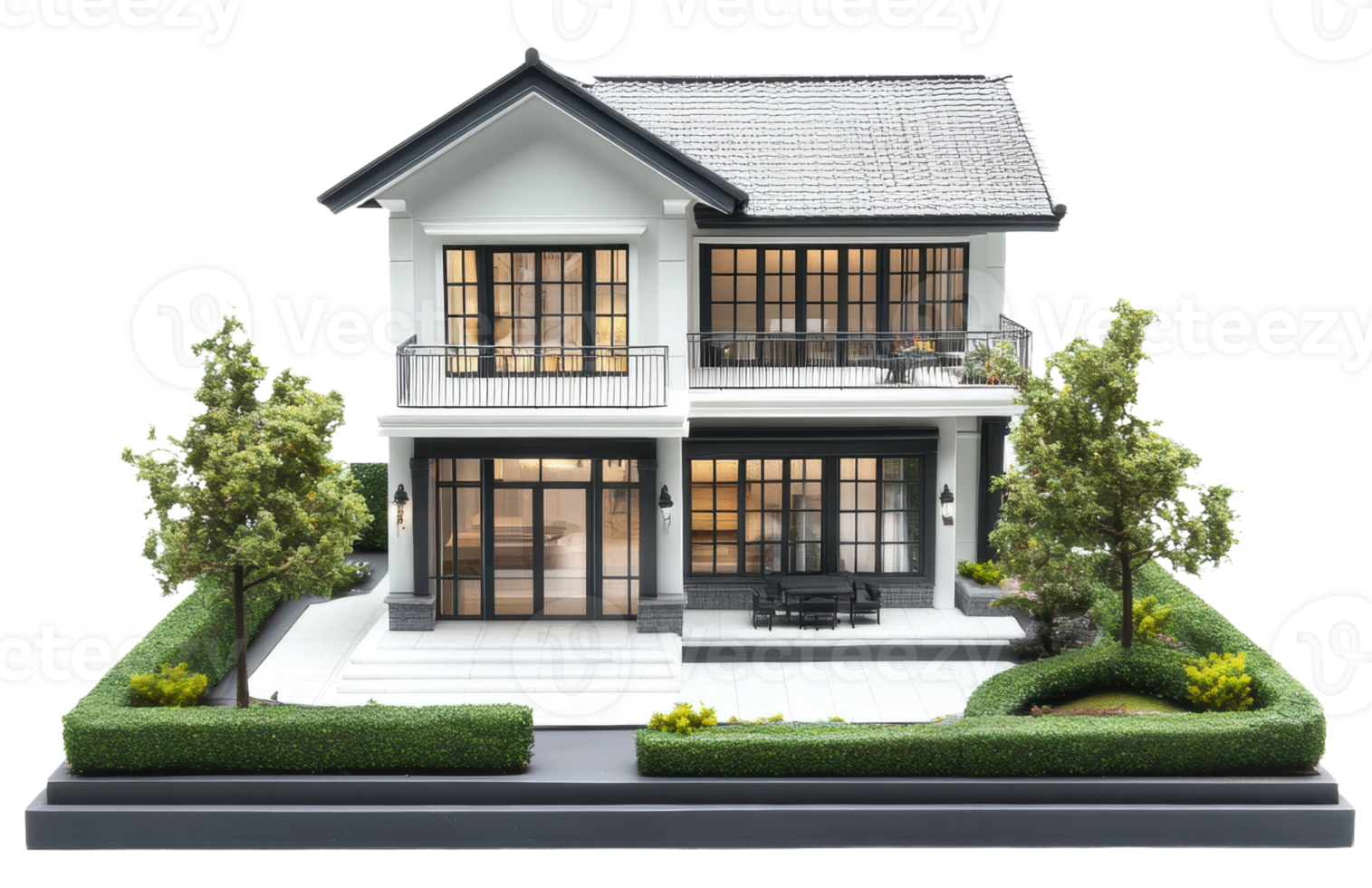 Modern two-story house model with landscaped garden displayed on a table, cut out - stock . png
