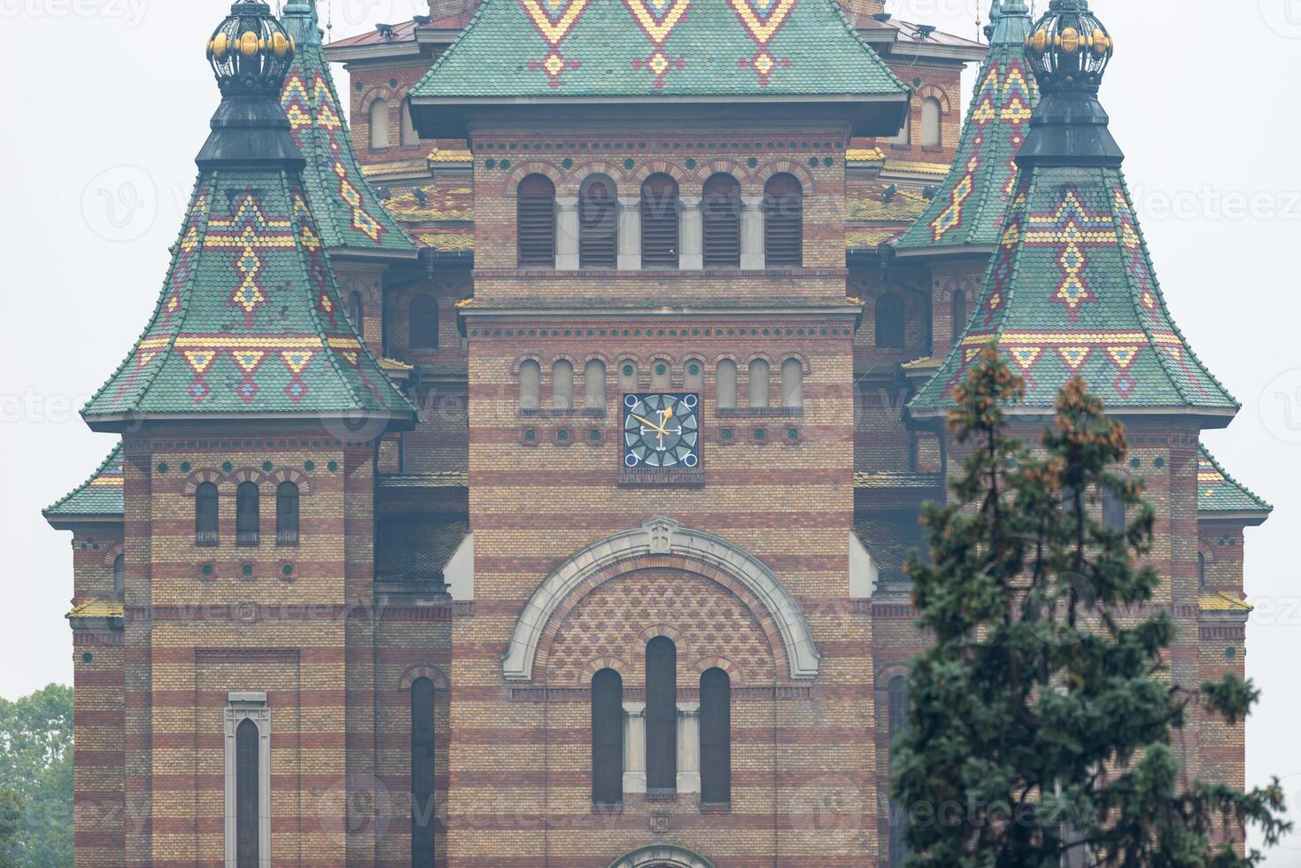 A close-up of the metropolitan orthodox cathedral of Timisoara on a foggy day photo