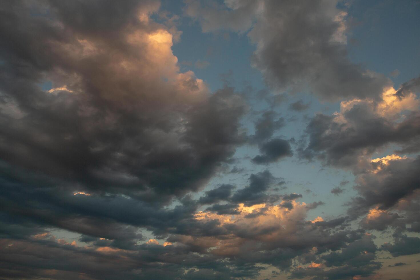 Cloudscape, Colored Clouds at Sunset near the Ocean in a Cloudy Day photo