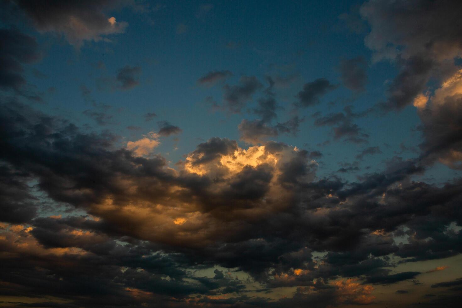 Cloudscape, Colored Clouds at Sunset near the Ocean in a Cloudy Day photo
