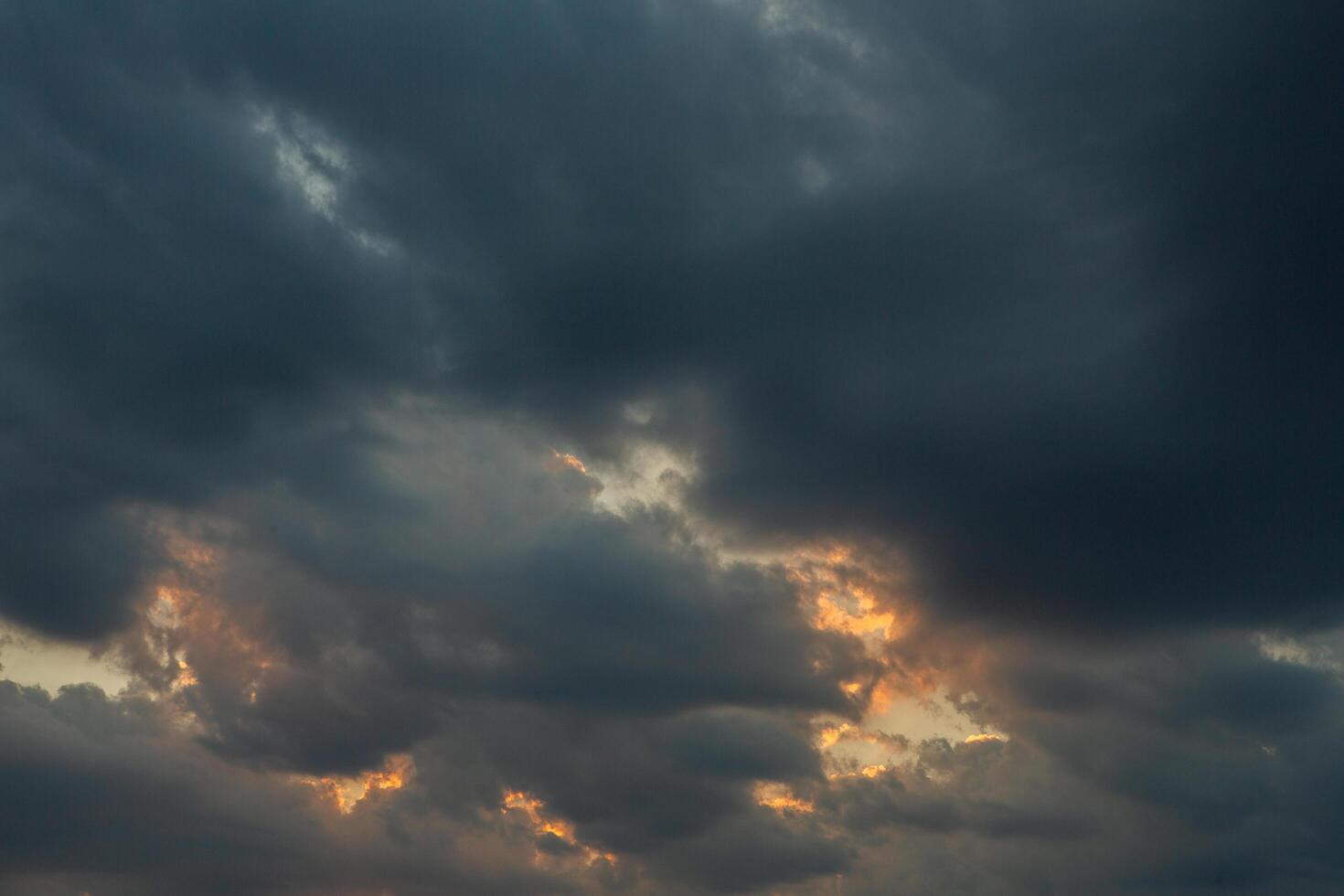Cloudscape, Colored Clouds at Sunset near the Ocean in a Cloudy Day photo