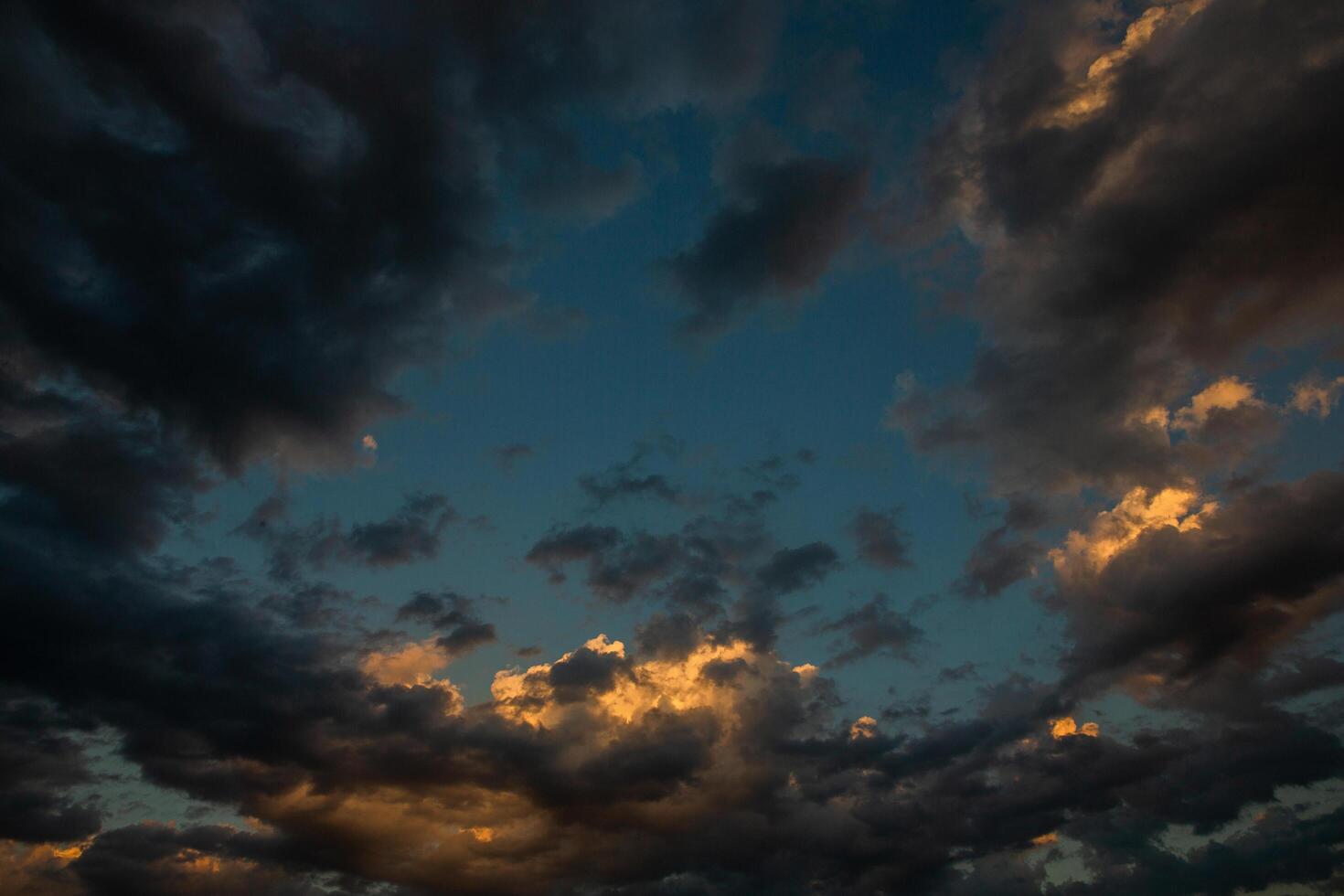 Cloudscape, Colored Clouds at Sunset near the Ocean in a Cloudy Day photo