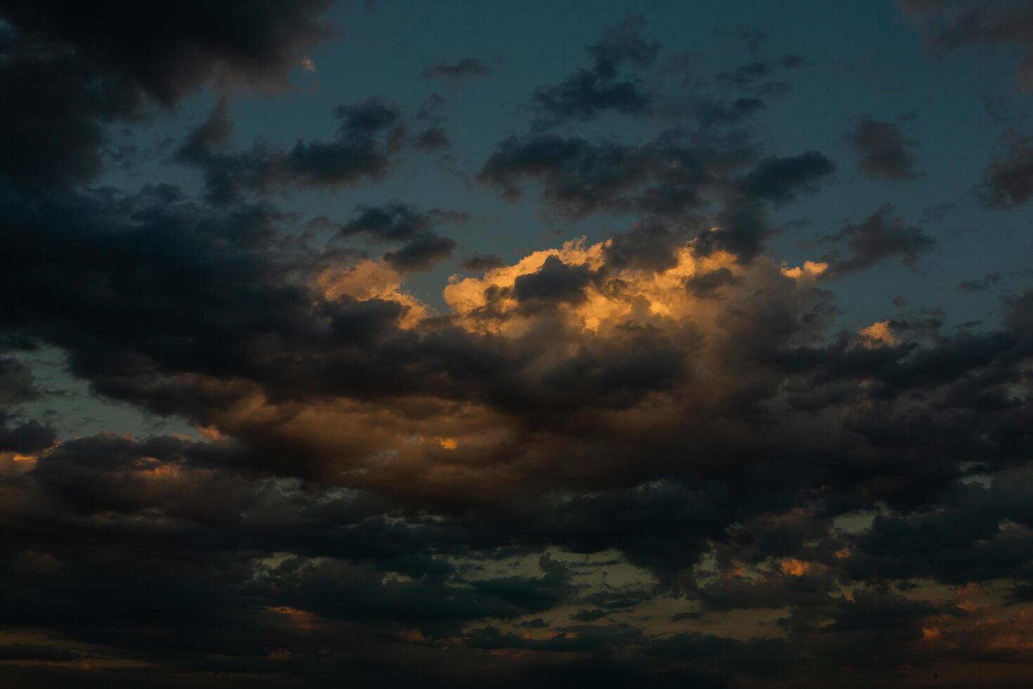 Cloudscape, Colored Clouds at Sunset near the Ocean in a Cloudy Day photo