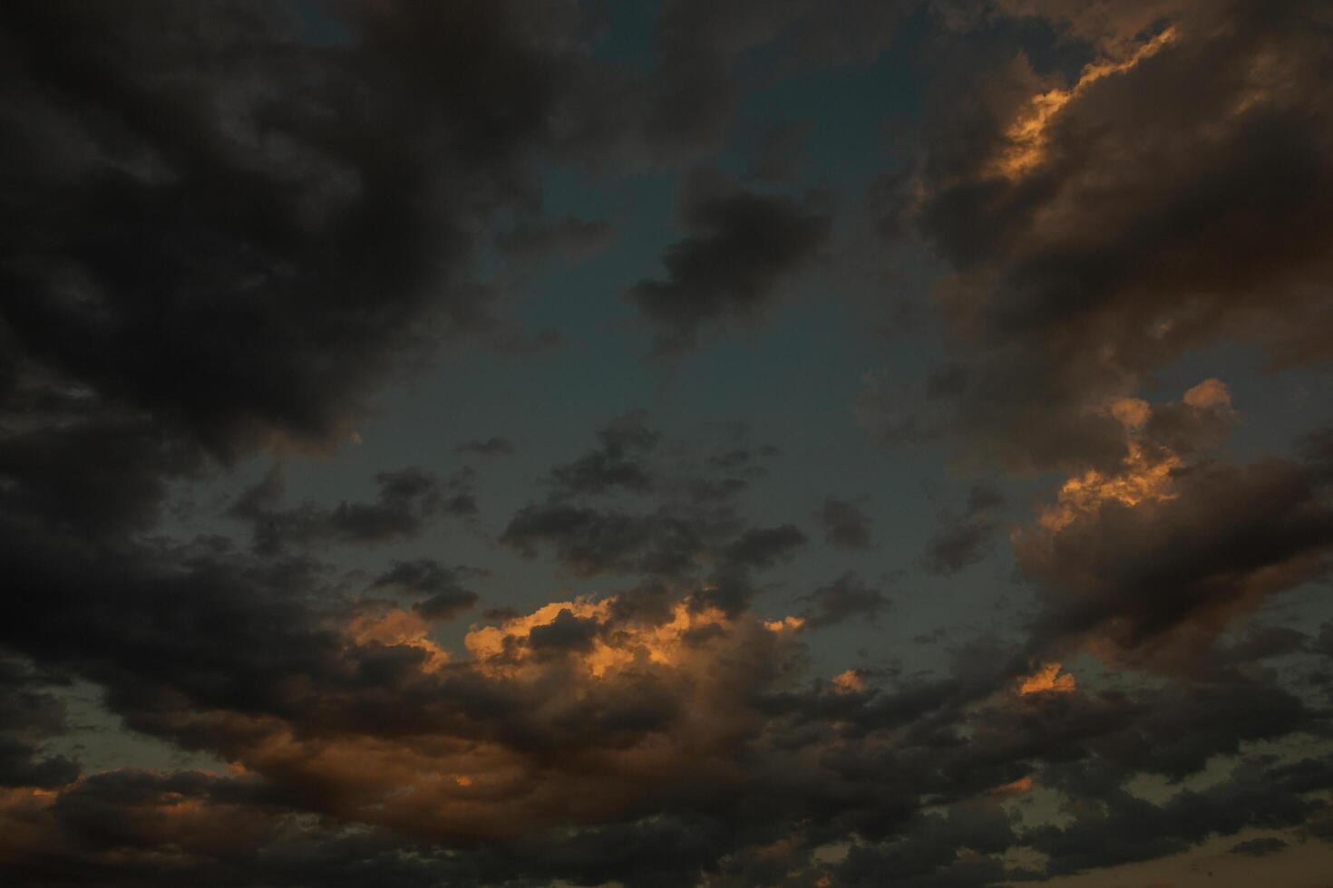 Cloudscape, Colored Clouds at Sunset near the Ocean in a Cloudy Day photo