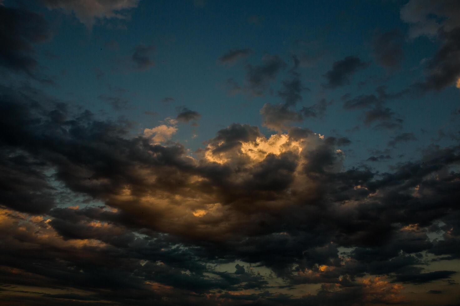Cloudscape, Colored Clouds at Sunset near the Ocean in a Cloudy Day photo