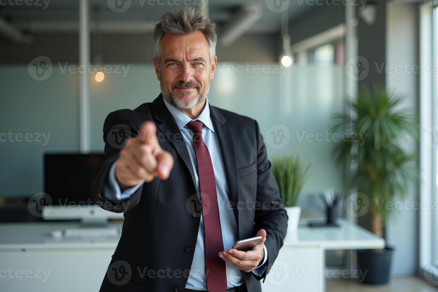 photo of man in suit outfit pointing index finger in the office,
