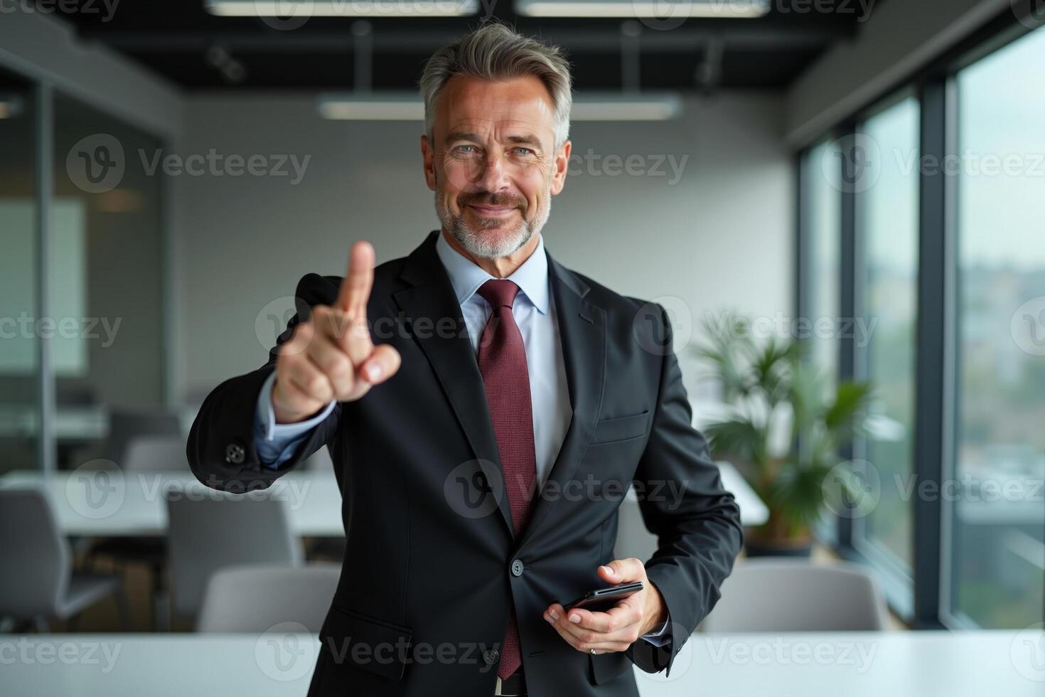 photo of man in suit outfit pointing index finger in the office,