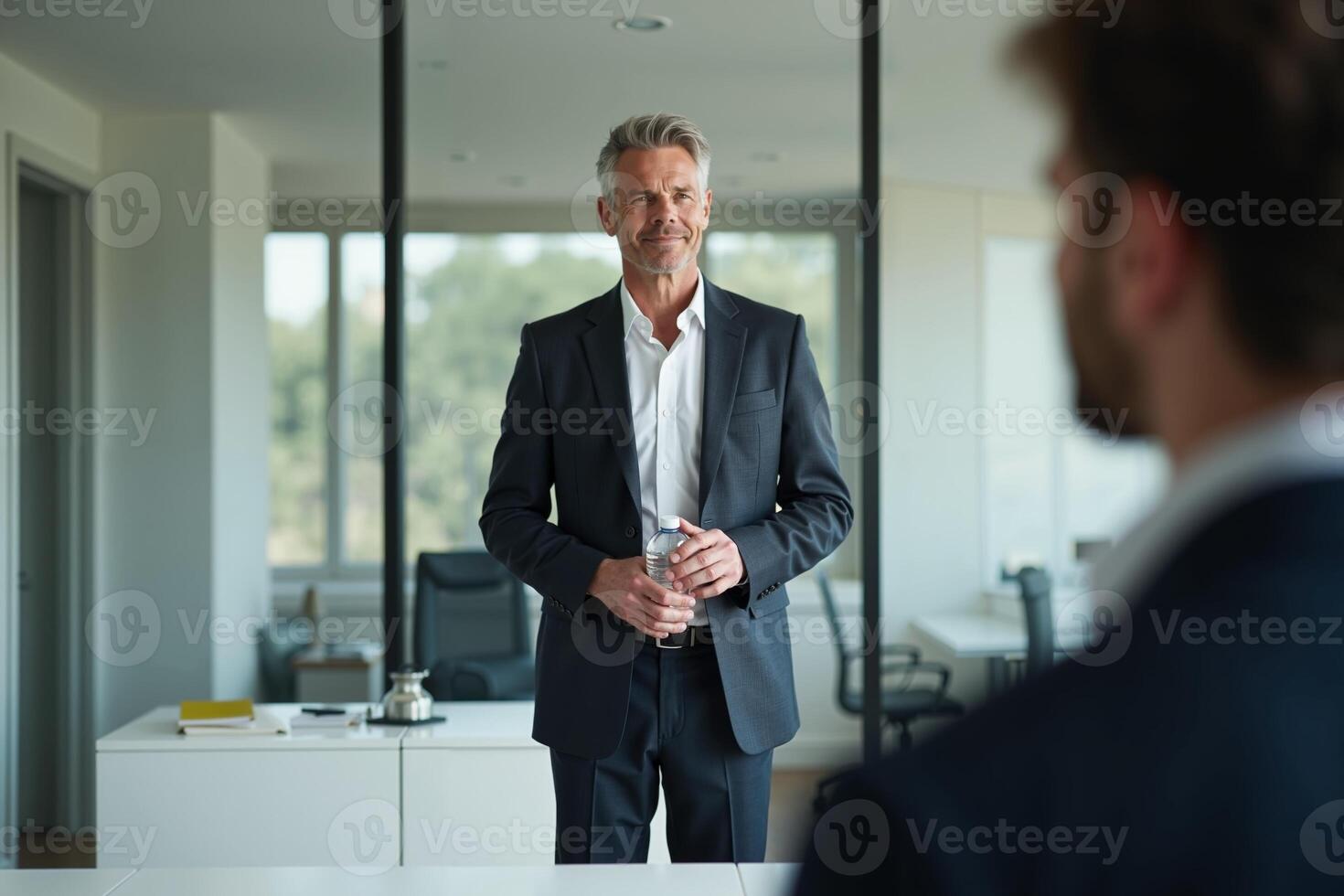 photo of man in outfit with hand giving bottle of water in the house,