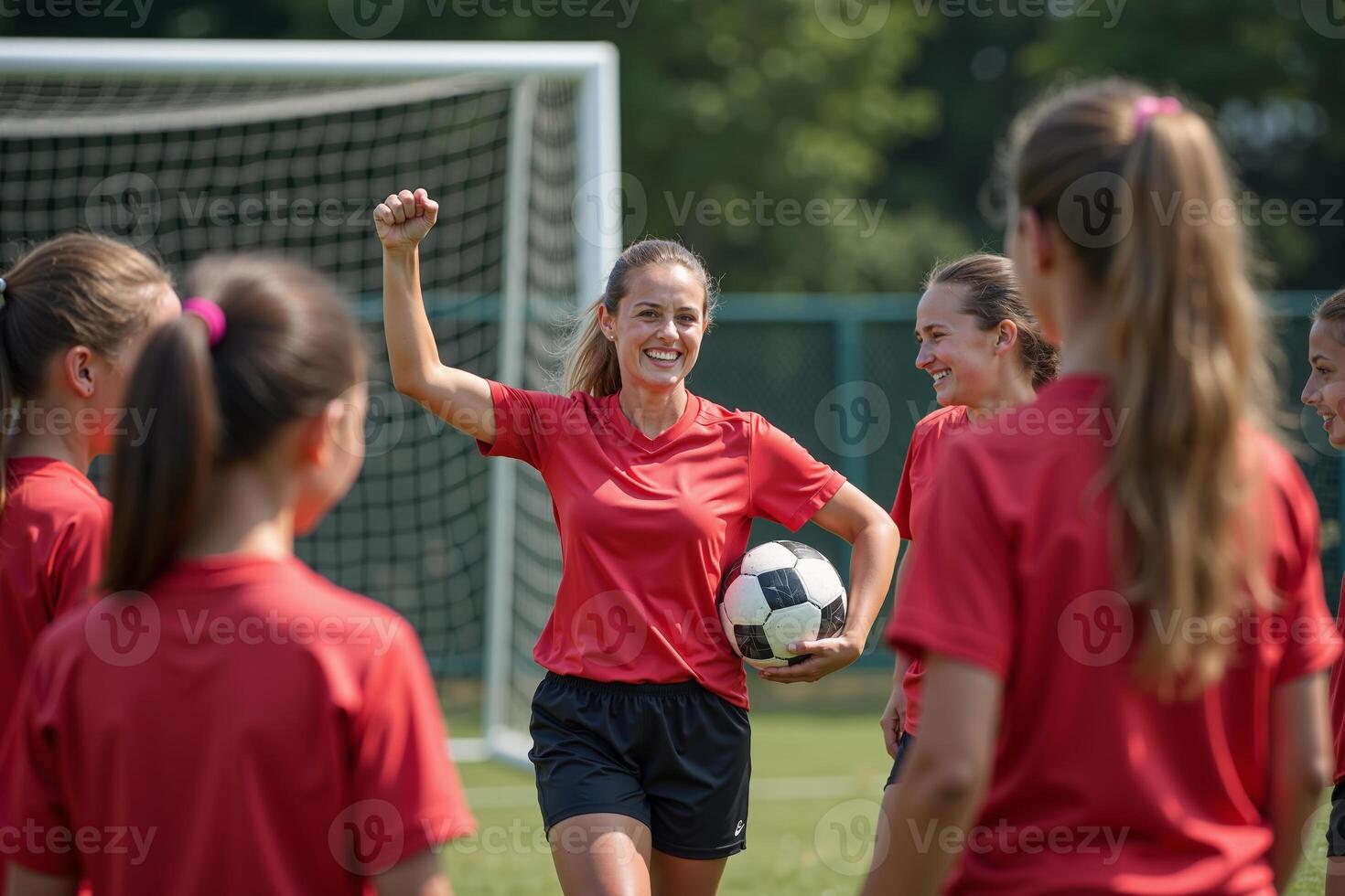 photo of coach instructor trainer teaching teenage player at soccer field,