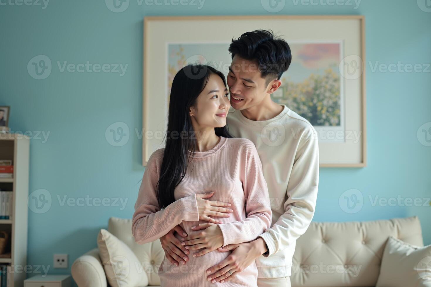 photo of couple man and pregnant woman relaxing standing both hands touching her belly at house,