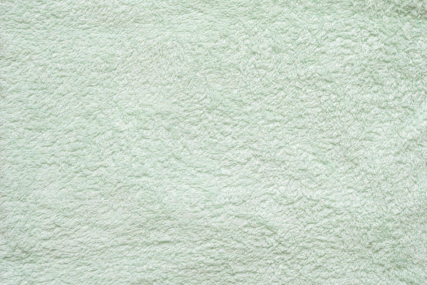 Green fluffy towel fabric soft texture background photo