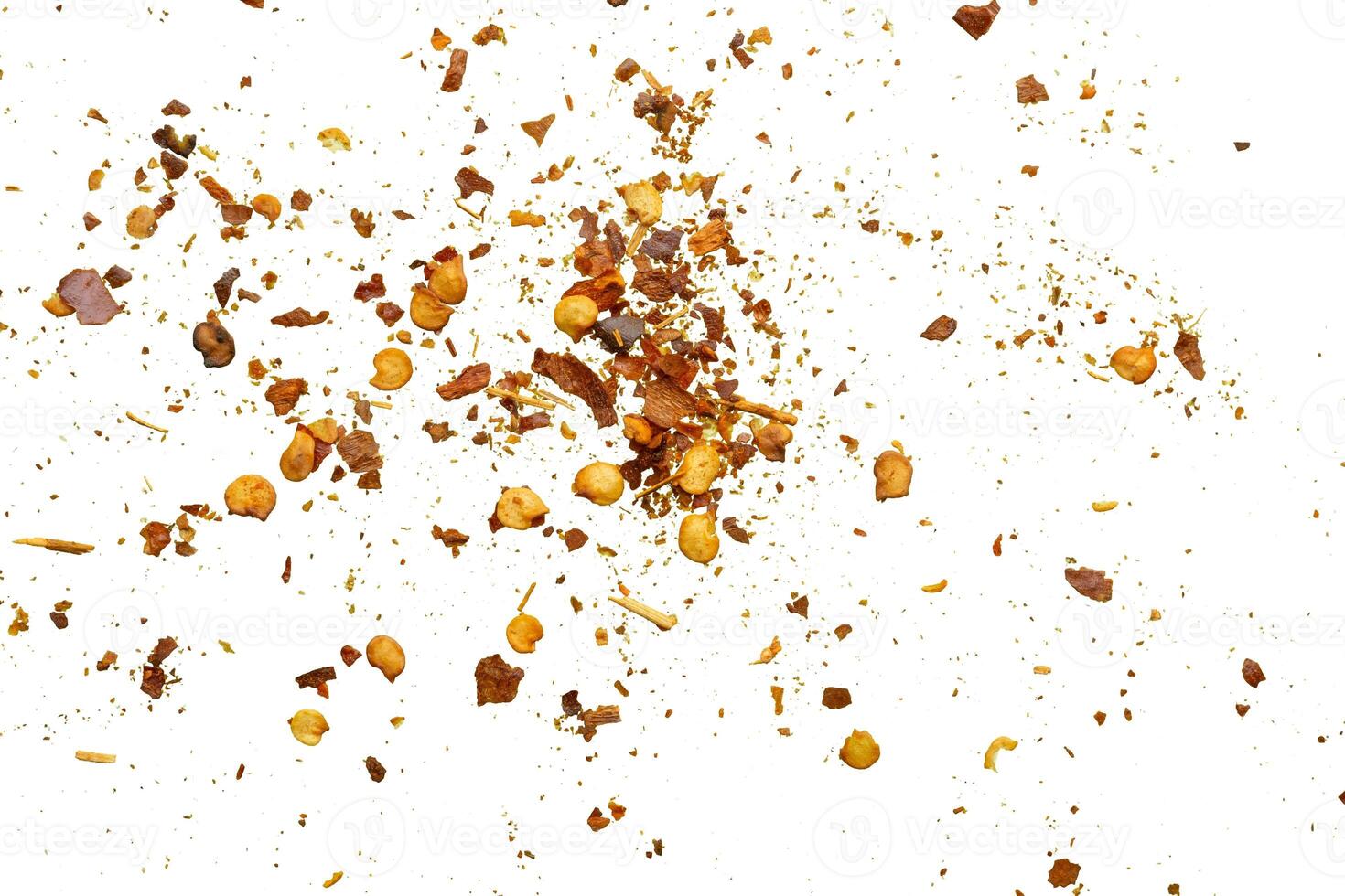 dried red chili pepper flakes and seeds isolated on white background photo