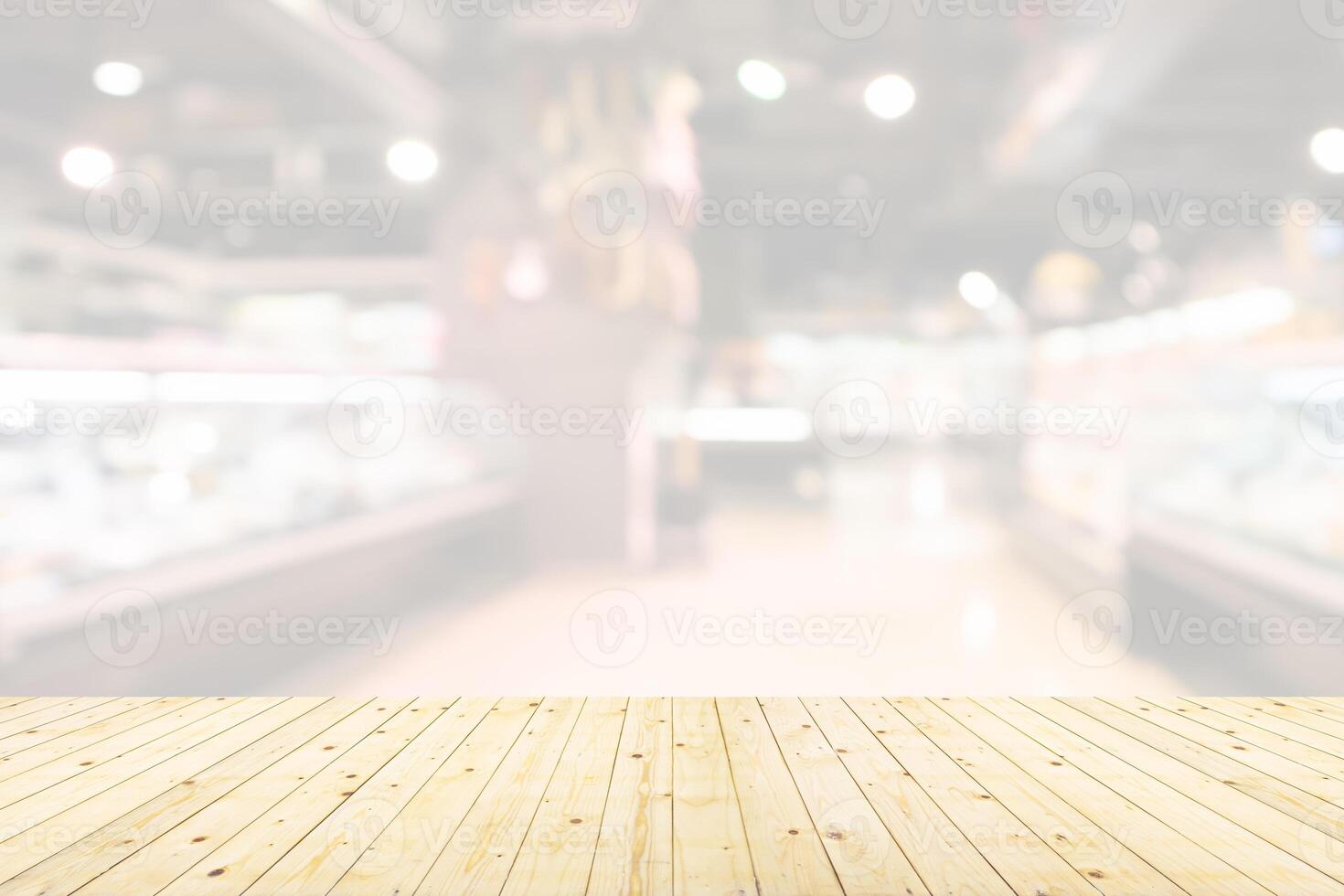Empty wood table top with supermarket blurred background for product display photo