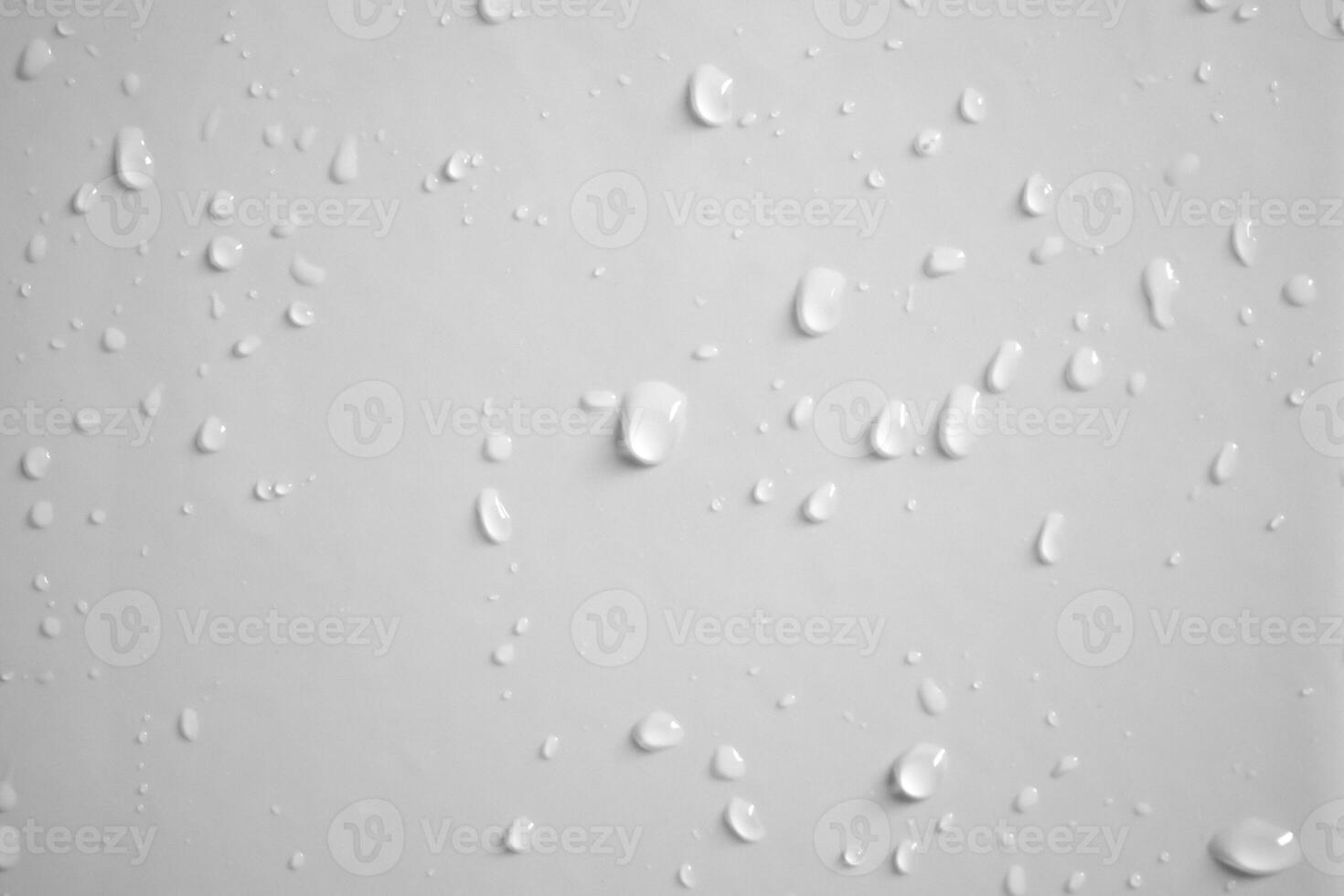 Water drops on white wall background texture photo