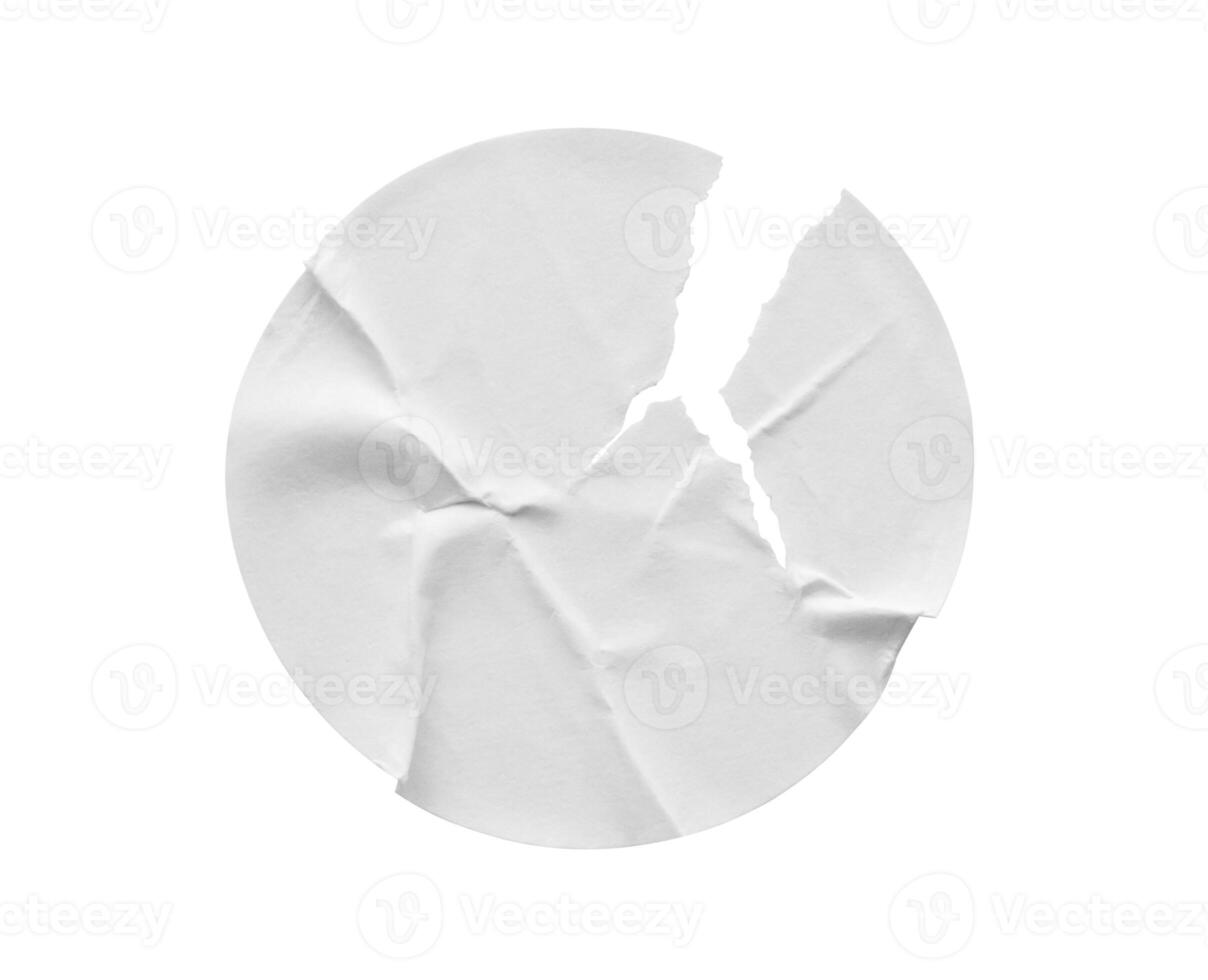 Blank white round torn paper sticker label isolated on white background photo