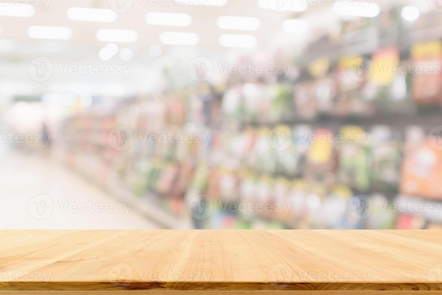 Empty wood table top with supermarket blurred background for product display photo