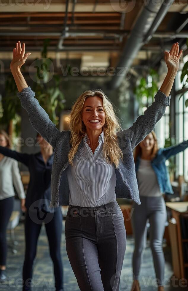 Office workers from different backgrounds engaged in group stretching exercises during a break photo