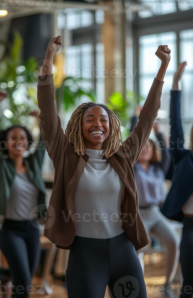 Office workers from different backgrounds engaged in group stretching exercises during a break photo