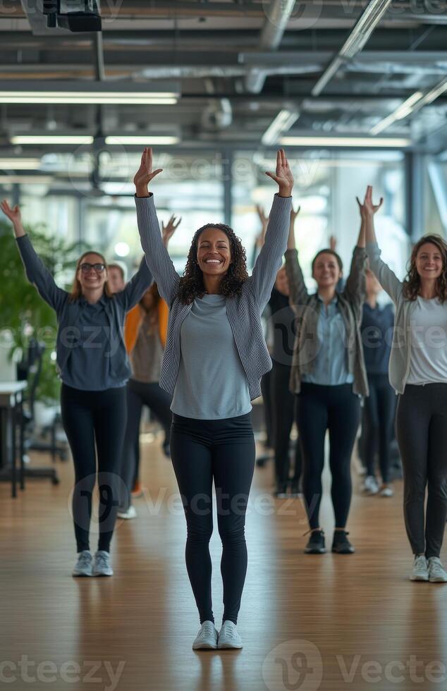 Office workers from different backgrounds engaged in group stretching exercises during a break photo