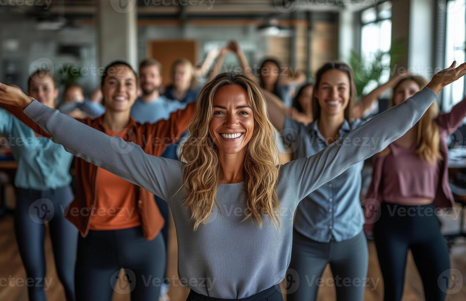 Office workers from different backgrounds engaged in group stretching exercises during a break photo