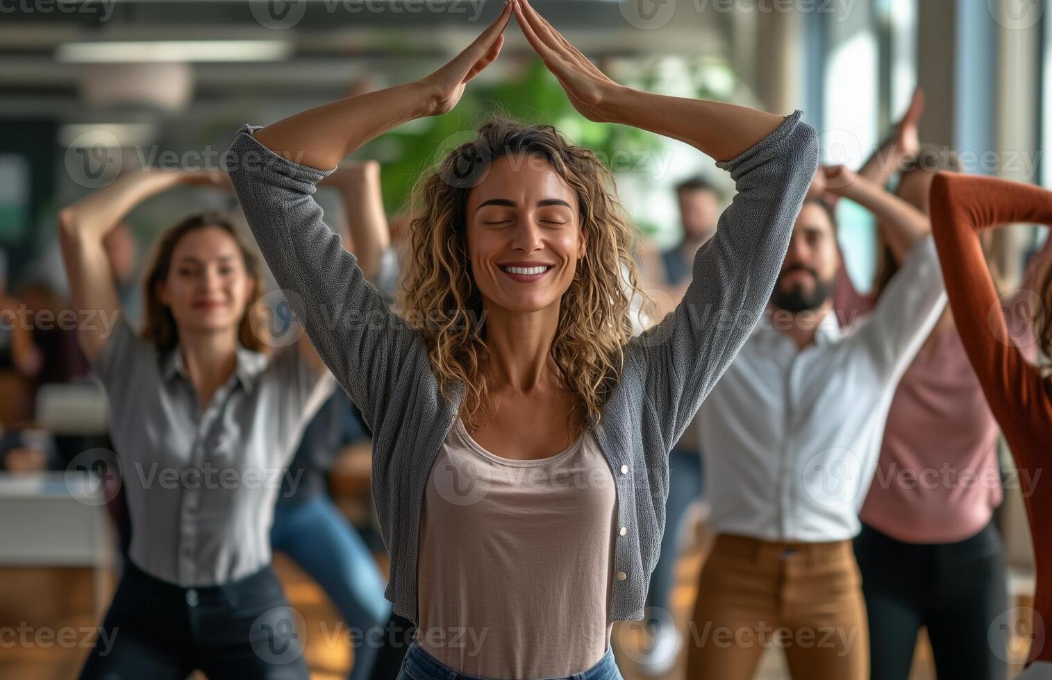 Office workers from different backgrounds engaged in group stretching exercises during a break photo