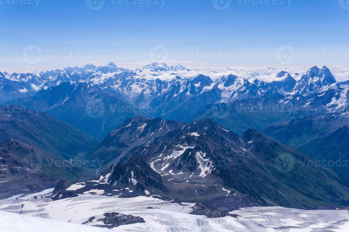 view from the top of the mountain, beautiful mountain landscape in blue atmospheric haze photo