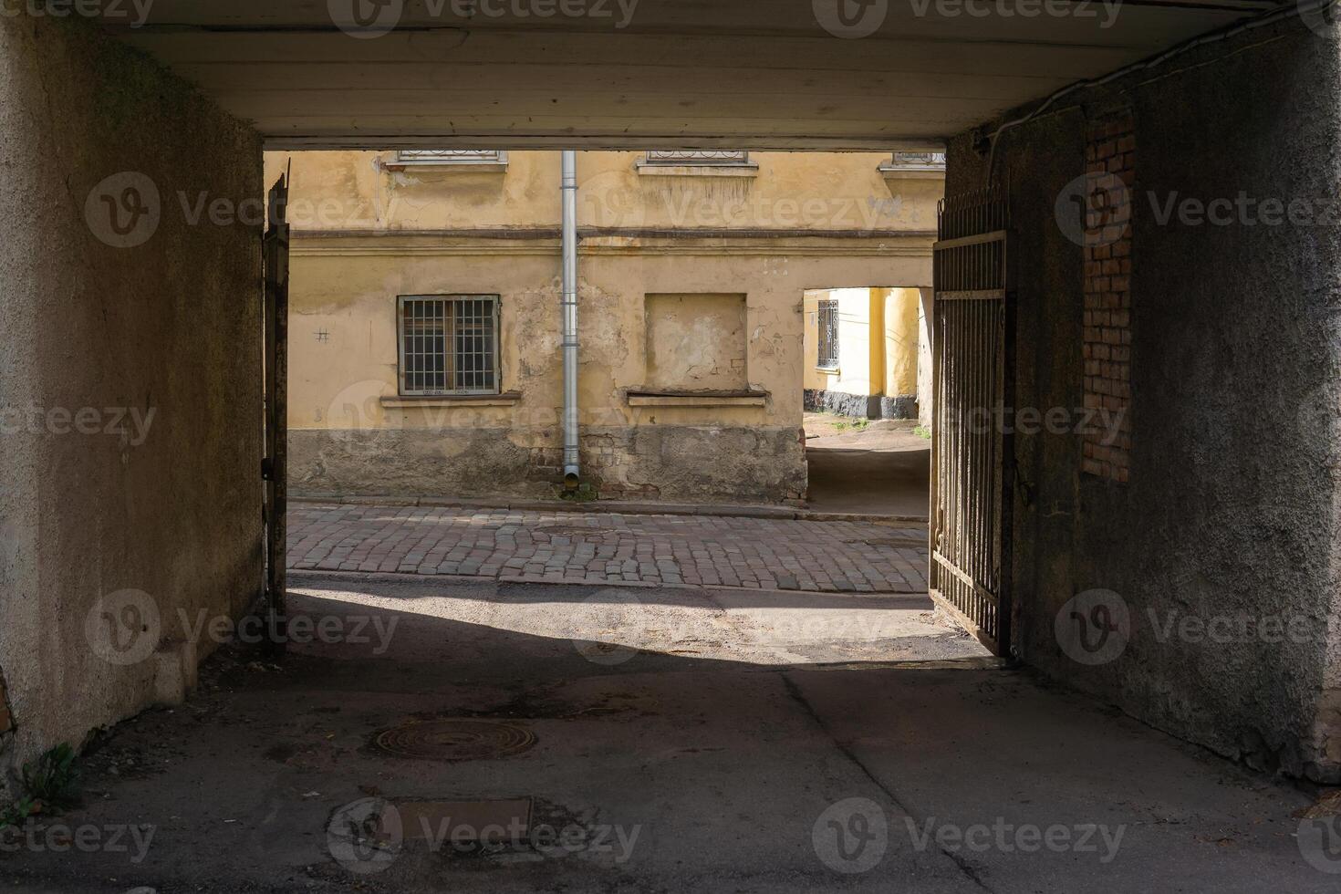 urban background, view from the gateway to the ancient street photo