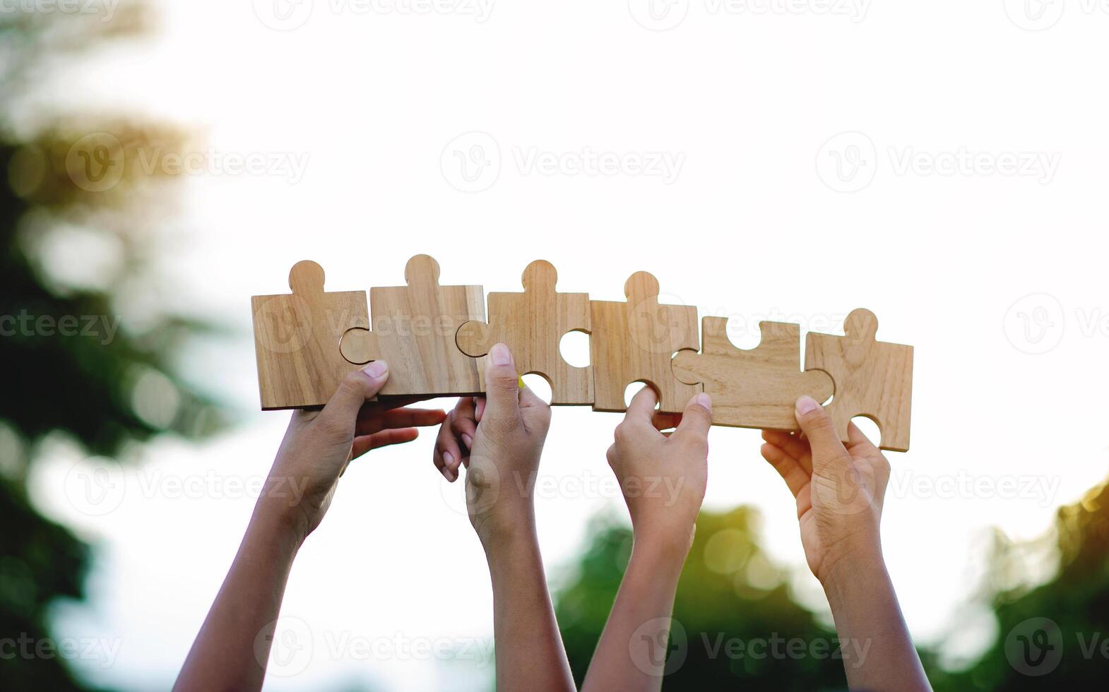 Jigsaw puzzle of unity, cooperation among groups, teamwork, team connection and support photo