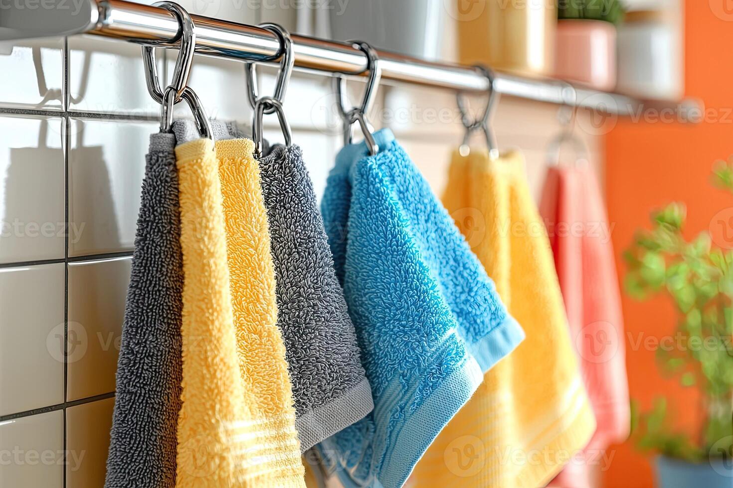 Kitchen towels hanging on a rack on a white brick wall photo