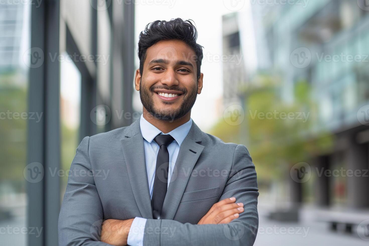 Indian Male Realtor in City, smiling confidently in an urban setting. photo