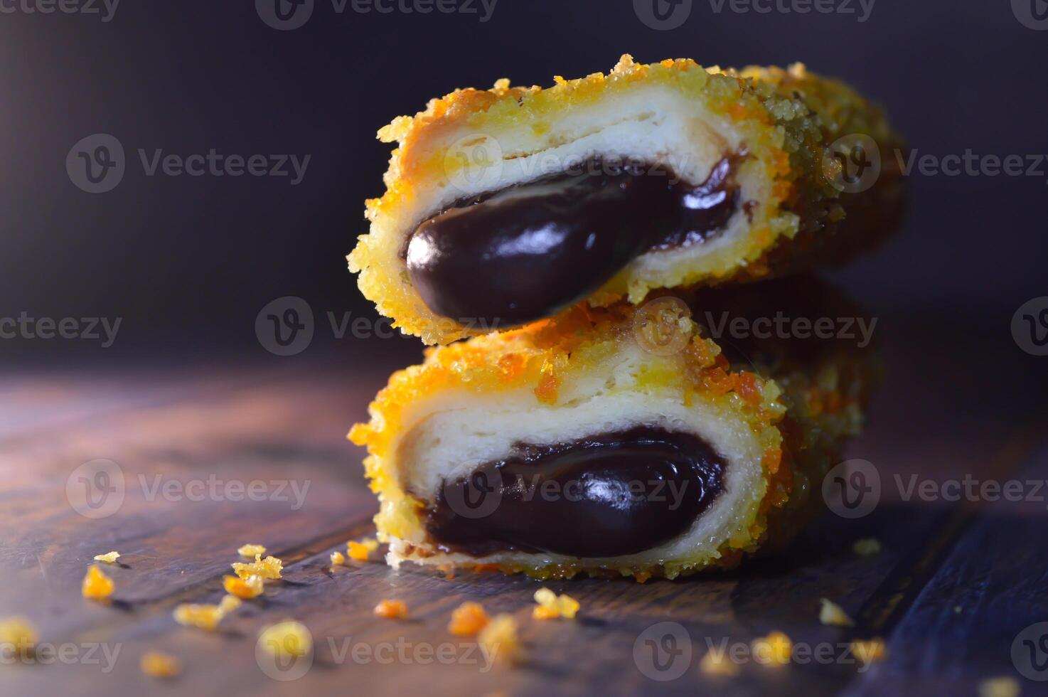 Fried bread filled with chocolate. the chocolate is melted and crunchy. photo