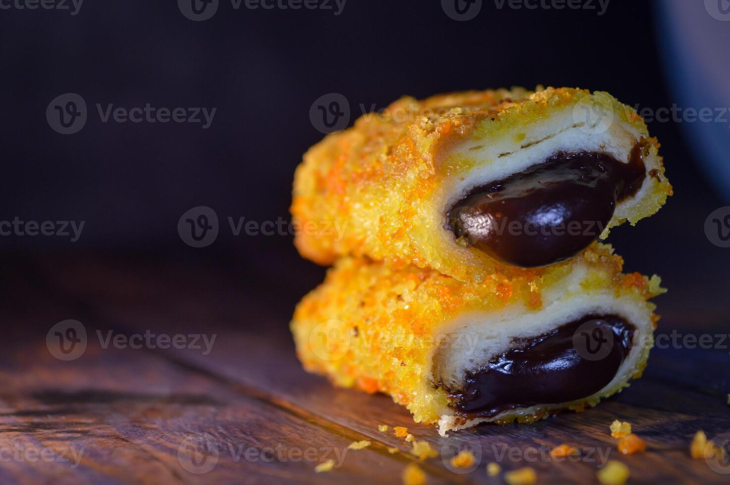 Fried bread filled with chocolate. the chocolate is melted and crunchy. photo