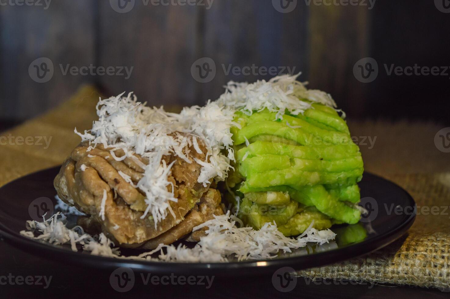 Textured, made from processed cassava that is steamed and mashed. Served with grated coconut. photo