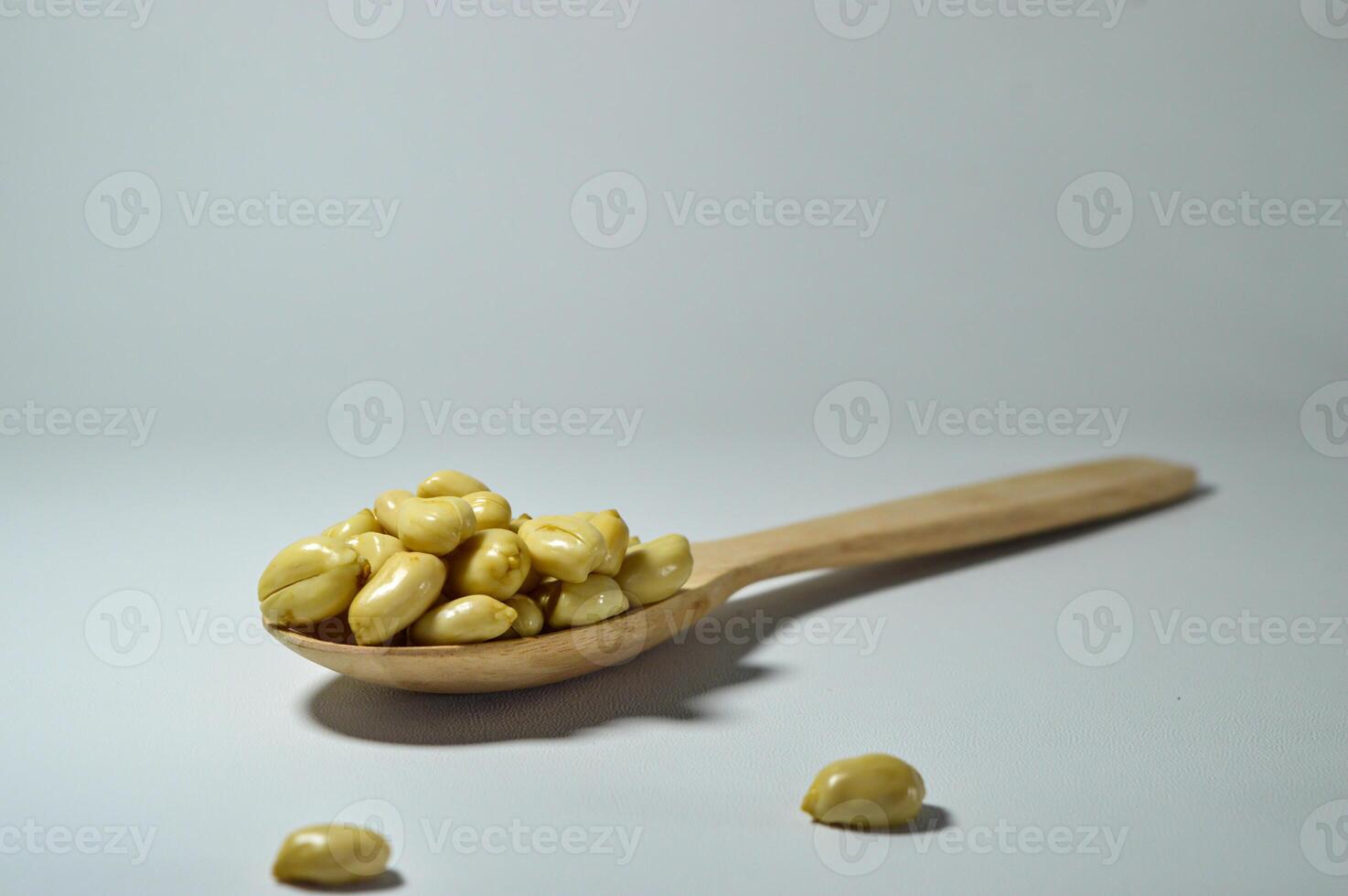 Fried peanuts. Served in a transparent jar. Selective focus photo