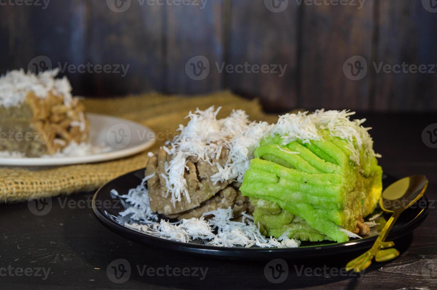 Textured, made from processed cassava that is steamed and mashed. Served with grated coconut. photo