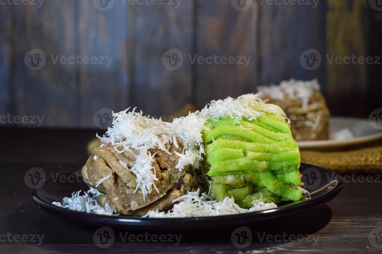 Textured, made from processed cassava that is steamed and mashed. Served with grated coconut. photo