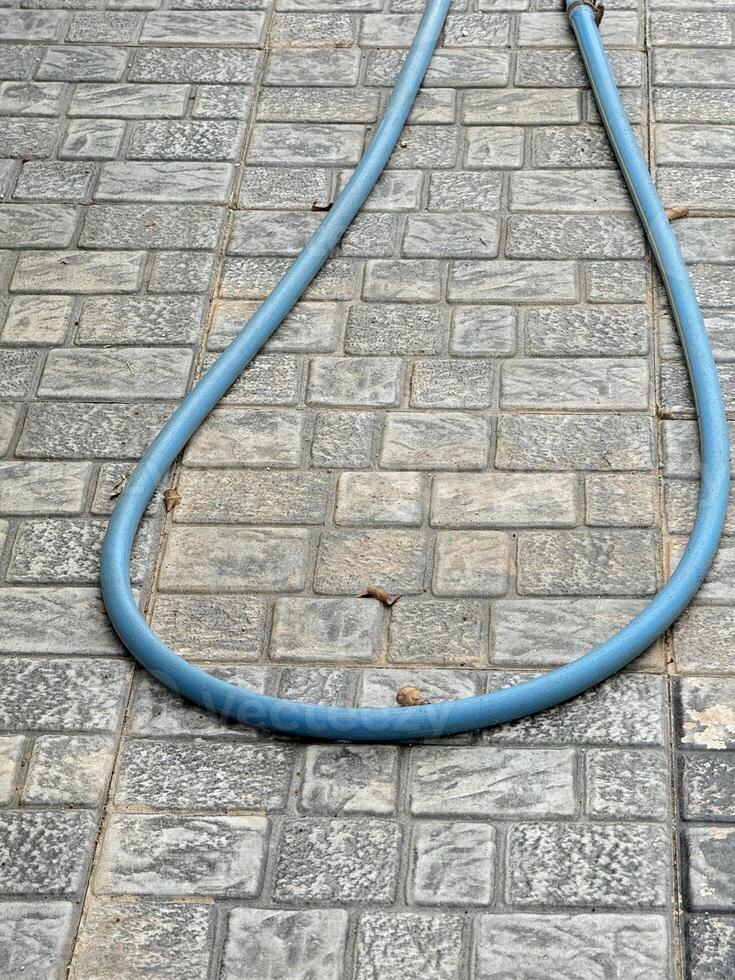 hose on cement floor photo