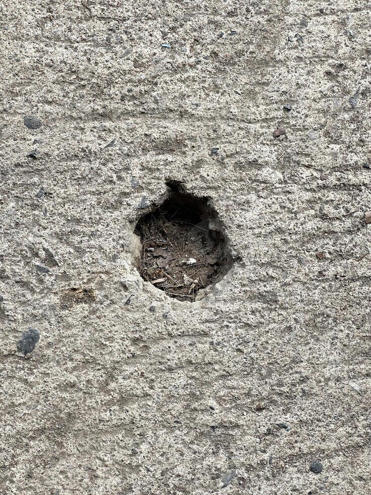 old concrete wall with cracks photo