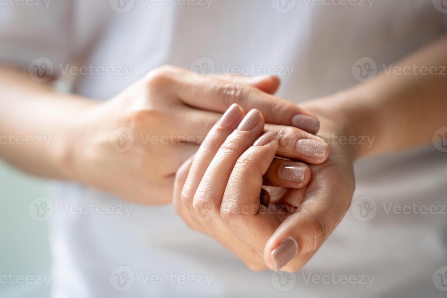 Young woman's hands with well-groomed fingers in a beauty salon photo
