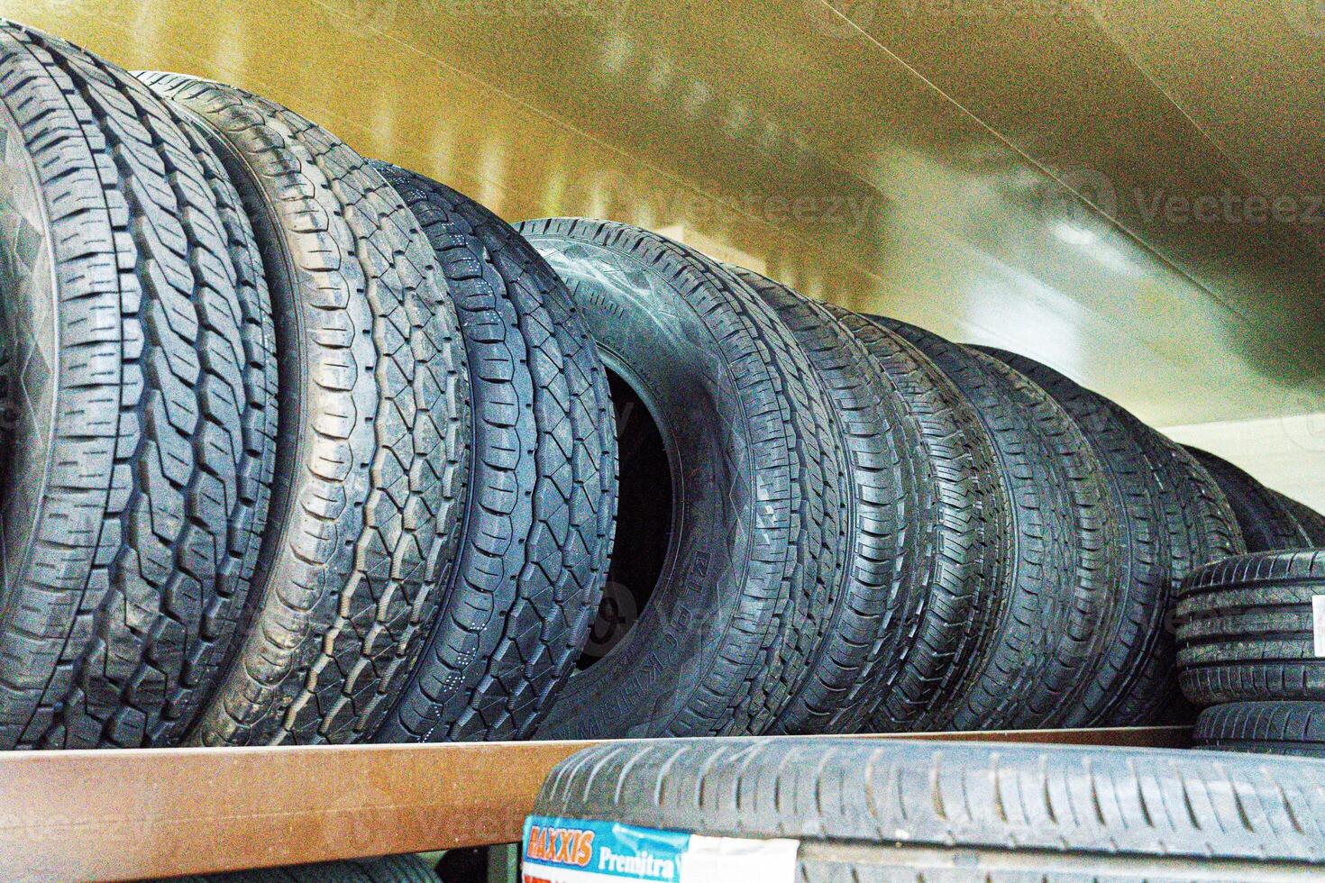 Stacked Tires in a Shop photo