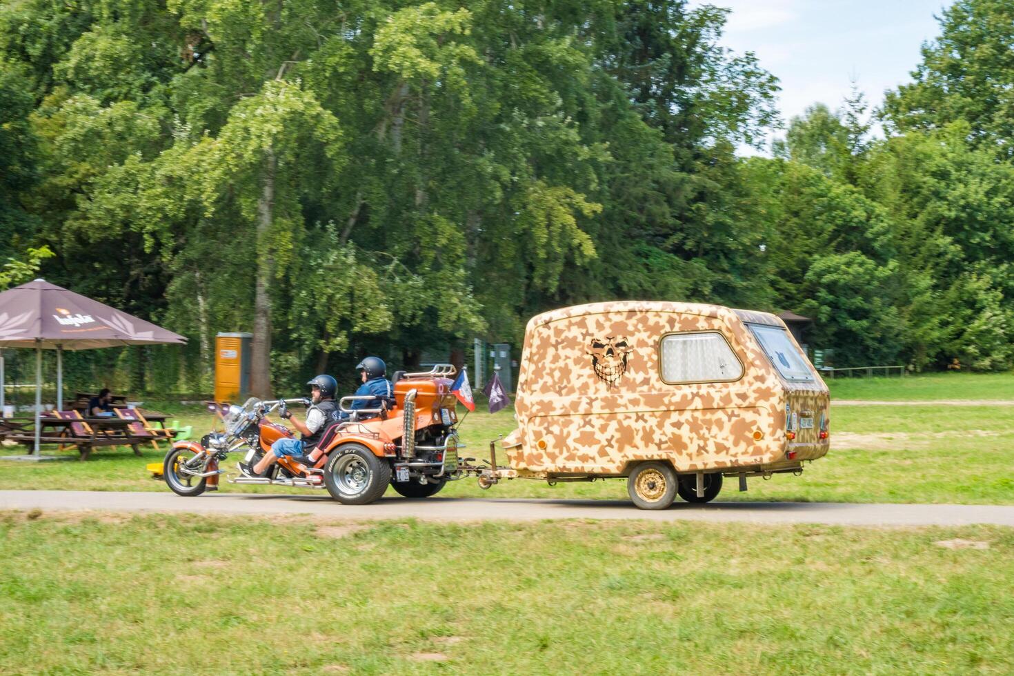 Podebrady- Czech- 27 July 2024. three-wheeled motorcycle with a trailer for rest photo