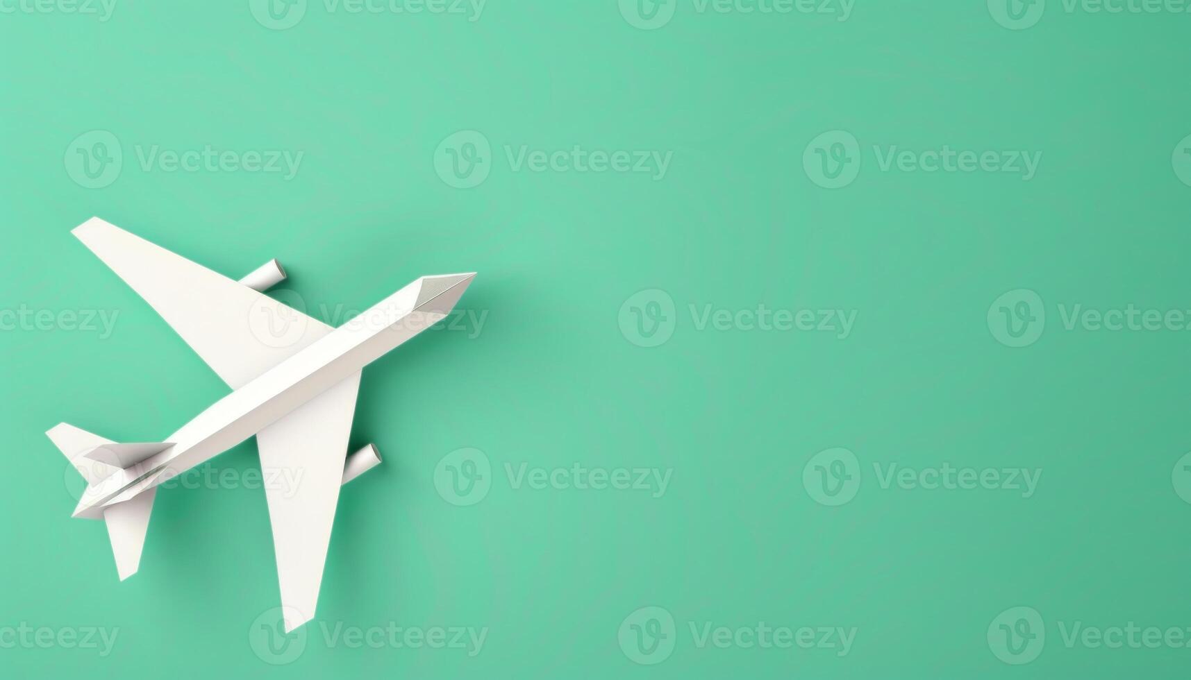 Origami Airplane for Travel Concept. Paper Airplane Model on Green Background with Copy Space photo